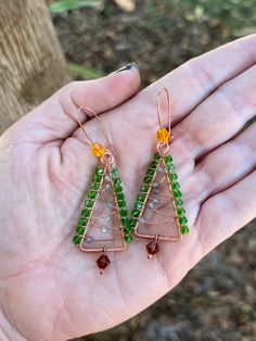 Each set is made to order. Hand made and hand coiled high quality copper Christmas Tree earrings made with Czech Crystals and little Labradorite ornament beads. These come on copper Kidney Wire ear hooks Earrings measure approximately 2.75" long (Top of ear hook to bottom bead) Please note that due to their handmade nature, these earrings may vary slightly from the stock photo pictured. Green Copper Wire Earrings Gift, Copper Beaded Earrings With Ear Wire As Gift, Wire Wrapped Beaded Earrings In Copper Wire For Gifts, Copper Christmas Tree, Crystal Labradorite, Copper Christmas, Crystal Christmas Tree, Tree Earrings, Christmas Tree Earrings