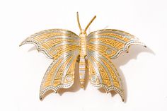 This pretty vintage brooch is a metal butterfly with gold with yellow enamel accents. It is more than 2 inches wide and signed Spain. Please examine the photos for exact size and condition and send me a message if you have any additional questions. I generally ship on the next business day and always am happy to combine multiple item purchases to save you on shipping costs. Thank you for looking at my store. Gold Butterfly Brooches For Collectors, Gold Butterfly Brooch Gift, Gold Butterfly Brooch As Gift, Gold Butterfly Brooch For Gift, Gold Butterfly Brooch For Formal Occasions, Gold Butterfly Brooches For Gift, Gold Butterfly Brooch For Wedding, Gold Butterfly Brooches For Wedding, Faux Pearl Bracelet