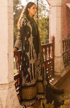 Pakistani Lawn Suit in Black Kameez and Trouser Style is a beautiful masterpiece adorned with lavish designs. Luxury embroidery work, patch details, and motifs make this beautiful Pakistani Eid Dress a chic choice to wear on the festive occasion for a stunning look. Detailed Description: SKU: PS1782 Detailing: Embroidery, Threads Color: Black Fabric: Lawn, Organza, Cotton Design: Fully Embroidered dress Event: Festive, Party wear Black Kameez, Pakistani Boutique, Lawn Suit, Pakistani Lawn Suits, Readymade Saree, Lawn Dress, Eid Dresses, Lawn Suits, Pakistani Designers