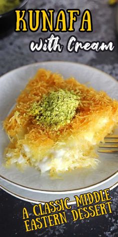 a close up of a slice of cake on a plate with a fork in it