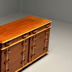 a large wooden chest with drawers on one side