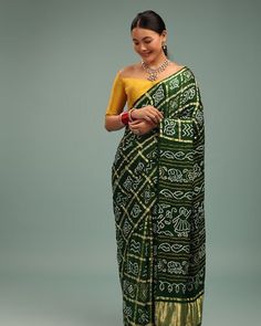 Forest Green Saree In Pure Silk With Bandhani Print & Brocade Work Step into enchanting elegance with our Forest Green Pure Silk Saree adorned with mesmerizing Bandhani print and intricate brocade work. Crafted to perfection, this saree captures the essence of timeless beauty and sophistication. The rich forest green hue adds a touch of mystique, while the exquisite detailing exudes opulence. Perfect for any occasion, this saree is sure to make you stand out with effortless grace and style. ... Bohemian Green Saree With Printed Motifs, Green Bandhani Print Pre-draped Saree For Festivals, Semi-stitched Green Saree With Printed Motifs, Bohemian Green Batik Print Saree, Luxury Green Bandhani Print Pre-draped Saree, Forest Green