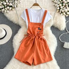 Cute Two-Piece Bib Shorts + White T-ShirtFabric: blendedColor: orange, blue, black, pink, purple, apricotSize(cm): free size(1inch=2.54cm)T shirtlength 52cm bust 86-100cmShorts&ltp&gtlength 76cm waist 82cm hips 103cm&lt/p&gt&ltbr/&gt&ltp&gtPlease check the size carefully when you choose items.&lt/p&gt&ltbr/&gt&ltp&gtFor more pictures of the set, please contact us, thank you.&lt/p&gt&ltbr/&gt Solid Color Short Top For Summer, Summer Solid Color Short Top, Short Solid Color Summer Tops, Short Solid Color Cotton Tops, Orange Solid Color Summer Tops, Trendy Orange Cotton Shorts, Casual Orange Top With Pockets, Orange Short Summer Tops, Casual Orange Shorts For Summer