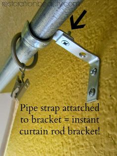 the pipe strap attached to bracket = instant curtain rod bracket is shown with an arrow pointing upward