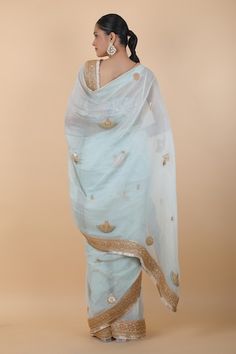 Wash blue saree with floral, peacock pair and border embroidery. Comes with coordinating unstitched blouse piece. - Aza Fashions Tissue Silk Dupatta With Embroidered Border For Reception, Dola Silk Sharara With Embroidered Border For Reception, Reception Dola Silk Sharara With Embroidered Border, Reception Sharara With Embroidered Border, Reception Dola Silk Dupatta With Embroidered Border, Traditional Blue Pre-draped Saree With Floral Embroidery, Unstitched Dupatta With Embroidered Border For Reception, Fitted Blue Saree With Embroidered Border, Festive Blue Pre-draped Saree With Embroidered Border