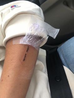 a person with a small tattoo on their arm