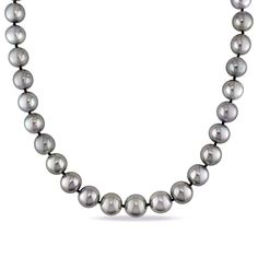 Subtle mystery bewitches this black cultured Tahitian pearl necklace. Pronounced with the exotic luster Tahitian pearls are known for, 28 smokey gemstones craft this strand complete with a luxe 14K white gold clasp. Romantic and iridescent, these pearls provide an all-time classic accessory punctuated with contemporary color. | Black Cultured Tahitian Pearl Necklace | 14K White Gold, 10-13Mm, 18 | Helzberg Diamonds Formal Black Tahitian Pearl Necklaces, Classic White Gold Tahitian Pearl Necklace, Formal Black Tahitian Pearl Necklace, Black Tahitian Pearl Necklaces With Round Beads, Black Tahitian Pearl Round Bead Necklaces, Black Tahitian Pearl Necklace With Round Beads, Black Tahitian Pearl Necklace, Black Tahitian Pearl Pendant Necklaces, Luxury Black Tahitian Pearl Necklaces