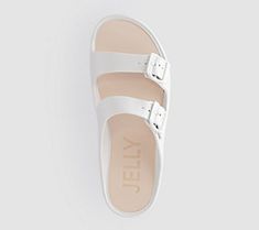 A pretty yet practical platform? Yes, please! These double-band slides are made for comfort with a foam insert and an adjustable design. But their cuteness? Off the charts. From Lemon Jelly. White Trendy Slip-on Jelly Sandals, White Slide Clogs For The Beach, White Summer Slide Clogs, White Slide Clogs For Summer, Trendy Synthetic Double Strap Slides, Trendy Double Strap Synthetic Slides, White Adjustable Sandals For Everyday Wear, Summer Slide Clogs With Cushioned Footbed, Comfortable White Open Toe Mules