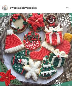 decorated christmas cookies are arranged on a plate