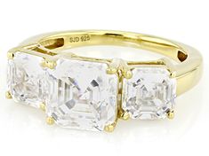 Moissanite Fire® 4.86ctw diamond equivalent weight asscher cut, 14k yellow gold over silver  three stone ring. Measures approximately 5/16" L x 1/16" W and is not sizeable. Actual moissanite weight is 3.93ctw. Gold Three Stone Asscher Cut Jewelry, Gold Asscher Cut Three Stone Jewelry, Three Stone Rings, Three Stone, Stone Rings, Yellow Gold, Yellow, Stone, Silver