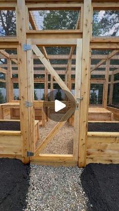 the inside of a chicken coop with an open door