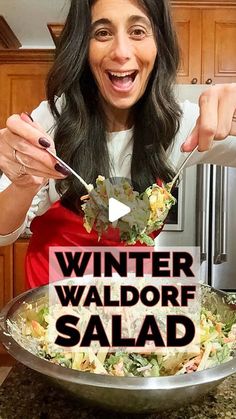 a woman is smiling while holding a fork and salad in front of her face with the words winter waldorf salad on it