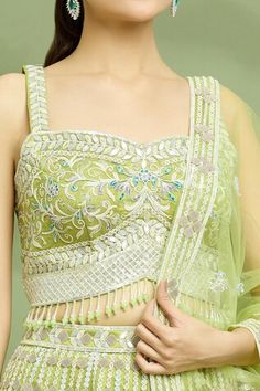 Light mehendi cancan attached scallop hem lehenga featuring sequin and applique work all over. Paired with a padded hand embroidered tassel detailed blouse and a hand embroidered dupatta. - Aza Fashions Fitted Lehenga With Motifs, Sleeveless Choli With Motifs For Wedding, Wedding Dresses With Motifs, Pista Green Choli For Party, Party Choli In Pista Green, Lehenga Pattern, Lehenga Blouse, Scalloped Hem, Sequin