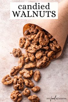 a paper bag filled with candied walnuts