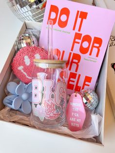 a pink box filled with lots of different items