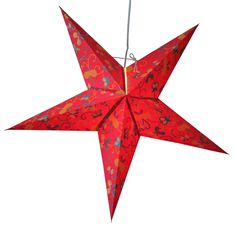 a red origami star hanging from a string