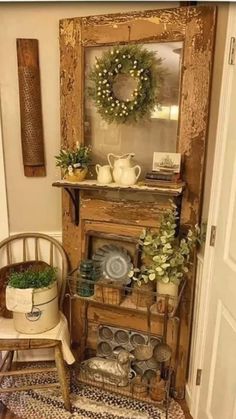 a room with a chair, potted plants and a mirror on the wall above it