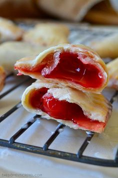 some pastries are sitting on a cooling rack and ready to be eaten by someone