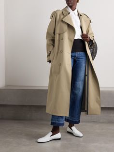 Stella McCartney's Summer '24 collection is inspired by photographs of the designer's parents in the '70s - the trench coats are specifically informed by an image of them carrying her off a plane as a child. Made from cotton-gabardine, this double-breasted style has all the classic details like sizable shoulder epaulettes, storm flaps and buckled cuffs. Use the detachable belt to cinch the shape. Luxury Gabardine Double-breasted Outerwear, Double-breasted Gabardine Outerwear With Pockets, Gabardine Button-up Outerwear With Hidden Button Closure, Stella Mccartney Sustainability, Stella Mccartney Coat, Shoulder Epaulettes, Stella Mc, Sports Suit, Green Coat