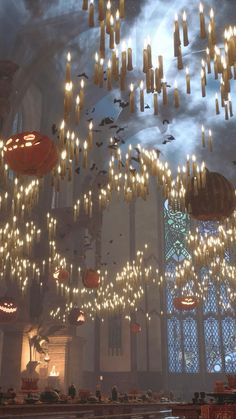 a large room filled with lots of lights and chandeliers hanging from the ceiling