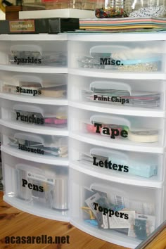 the drawers are labeled with different types of tape and other crafting supplies on them