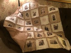 an old photo quilt is draped on a couch