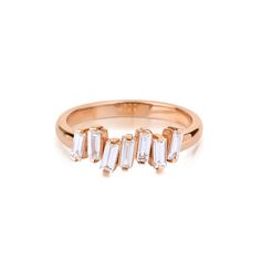 a gold ring with five baguettes on it