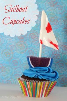 a cupcake with a sailboat on top and the words sailboat cupcakes above it