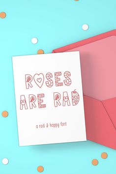 a card with the words roses are red and happy font on it next to an envelope