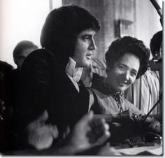 black and white photograph of two people sitting next to each other