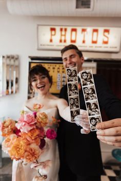 a bride and groom holding up their wedding photos