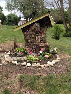 a tree stump with a house built into it