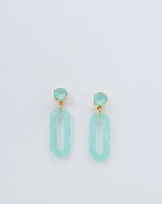 STYLE These mint green earrings are the ultimate warm weather accessory. The lightweight construction ensures all day comfort. DETAILS Features mint green stone and mint green acrylic element. Length: 1.5" Width: 0.6" Weight: 0.14 oz Nickel Free, Hypoallergenic, Stainless Steel Post Back Lightweight Packaged with gold bow JEWELRY CARE You can maintain the sparkle and shine of your TrendingAbove jewelry by avoiding direct contact with water, chemicals, perfume, lotions and sprays. Storage of jewe Green Resin Earrings For Summer, Green Dangle Earrings, Mint Green Earrings, Light Weight Jewelry, Color Earrings, Bow Jewelry, Steel Post, Green Earrings, Green Stone