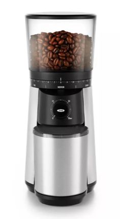 an image of a coffee maker with beans in it