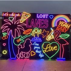 a large neon sign that says lost lanes and love is written on the side of it