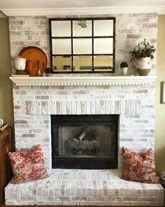 a living room with a fire place sitting next to a mirror on the fireplace mantel