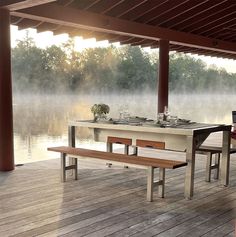 a table and benches on a wooden deck