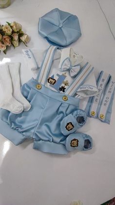 NOTE Please visit my shop for many other kids costumes and custom made outfits.. https://www.etsy.com/shop/SammysCostumes/?etsrc=sdt This Personalized Baby Boys 1st Birthday Suit Set Short Tuxedo Suit is custom made to order. It comes with Shorts, Boys monogramed Shirt, Suspenders, Boys Bowtie and Free embroidery on arms. Boys  Animal Safari Theme First Birthday Outfit. Boys first birthday custom suit.  NOTE---- You can order different ages up to 7 years Old Suit Set NOTE--- You can email us here with any customization requests NOTE--- You can email us here with any color requests 4 PIECES SET INCLUDES--- Pants + Shirt + Suspenders + Bowtie  Please See Our Other Designs on Our Page  etsy.com/shop/SammysCostumes Baby to Boys Custom 4 Pieces Short Suit Boys Animal Design 4 Pieces Short Tuxed Blue Cotton Set For Birthday, Cute Blue Sets For Birthday, Cute Blue Party Sets, Cute Blue Sets For Baptism, Cute Blue Baptism Set, Customizable Fitted Sets For Baptism, Safari Theme First Birthday, Baby Boy Birthday Outfit, 1st Birthday Dresses