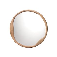 a round wooden mirror on a white wall