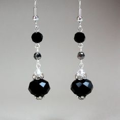 Vintage-look lovely long drop earrings in black and grey made with Swarovski crystals, glass crystals and rhinestones. Perfect for any occasion, weddings and parties or as a gift.   Materials used:  Swarovski crystals, clear (4 mm), glass rondelle crystals, black (12 mm), glass round crystals, black and grey (4 mm, 6 mm), rhinestone spacers, silver and antique silver colour plated base metal elements.  Colours:  Black, grey, clear crystal, silver. Measurements:  Approx. 1.75 inch (4 cm) long plu Pearl Wedding Jewelry Sets, Grey Crystals, Crystals Wedding, Rhinestone Jewelry Set, Pearl Jewelry Wedding, Bridesmaid Accessories, Long Drop Earrings, Bridesmaid Bracelet, Rhinestone Bridal