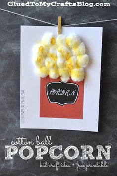 popcorn is hanging from a string on a chalkboard