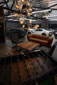 a living room filled with furniture and lots of lights hanging from it's ceiling