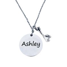 a necklace with the word ashley on it and a toothbrush attached to it