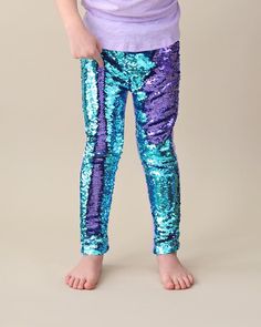 These fun, sequined pants are the perfect way to party in style! The cotton side provides breathable comfort, while the colorful reverse side is sequined flippin' fun!Front: 100% polyester Back: 100% cottonHand wash; hang dry Dress Up Leggings, Mermaid Pants, Aqua Pants, Pink Tutu Dress, Sequin Leggings, Twirly Dress, Toddler Pants, Pastel Dress, Sequin Pants