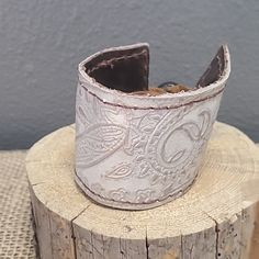 Off White Leather Cuff With Shiny Paisley Print. Adjust Leather Straps With Wood Bead. White Bohemian Cuff Bracelets, Handmade White Cuff Bracelet, Black Bangle, Handmade Evil Eye, Brighton Bracelets, Inspirational Bracelets, Glass Bracelet, Bead Charm Bracelet, Evil Eye Bracelet