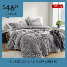 a bed with a comforter and pillows on it for $ 46 99 reg $ 79 00