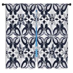 a window curtain with an abstract design on it