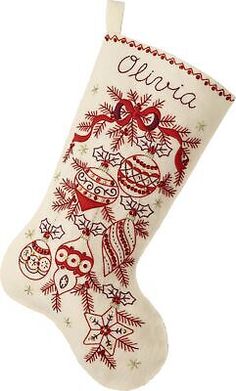 an embroidered christmas stocking with owls on it