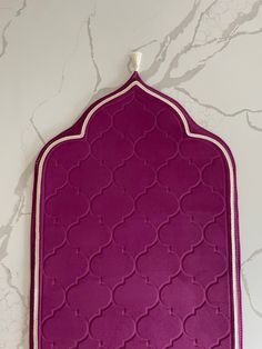 a large purple tray with white trim on the edges and an intricate design in the middle