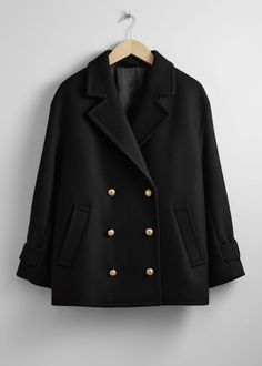 Oversized peacoat with a double-breasted silhouette.  • Dropped shoulders • Duo welt pockets • Button tabs at the cuffs Length of coat: 74cm / 29.1" (Size S) Peacoat Womens Outfit, Oversized Pea Coat, Black Peacoat, Navy Jacket, Jane Birkin, Fashion Story, School Fashion, Vintage Jeans, Black Jacket